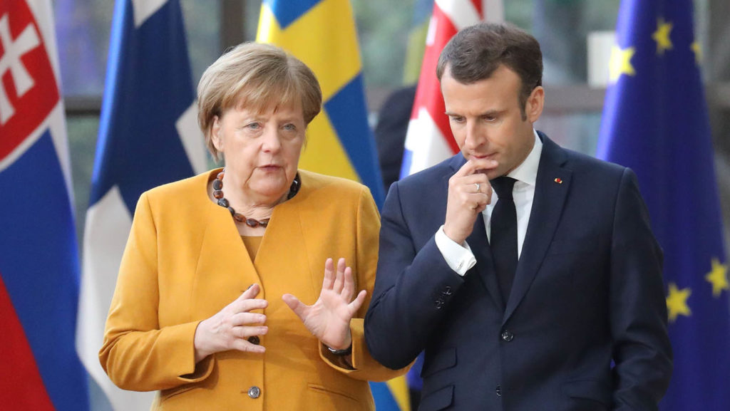 Macron und Merkel diskutieren