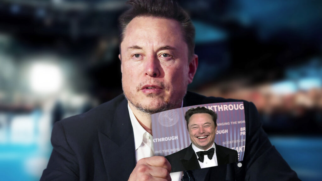 Das Bild zeigt Elon Musk, wie er ein Foto von sich selbst in die Kamera hält.