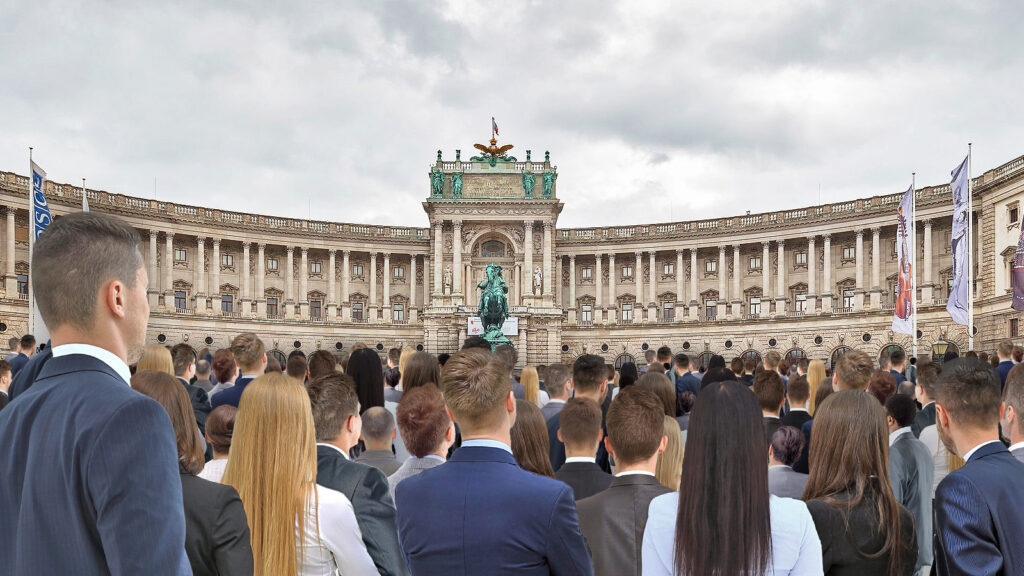 Das Bild zeigt eine große Menge Menschen vor der Hofburg.