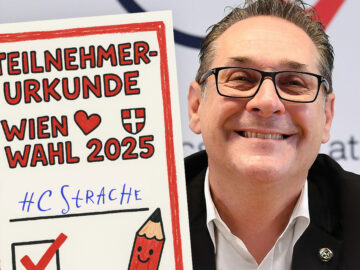 Das Bild zeigt einen lächelnden Strache neben einer kindlich aufgemachten Teilnehmerurkunde.
