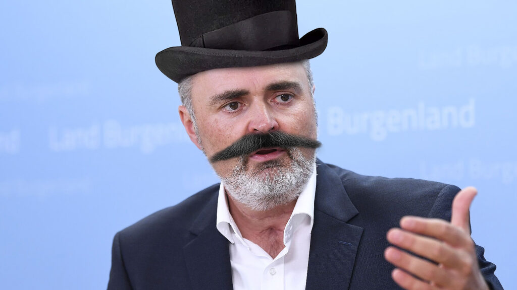 Das Bild zeigt Hans-Peter Doskozil mit einem Schnurrbart und Zylinder.
