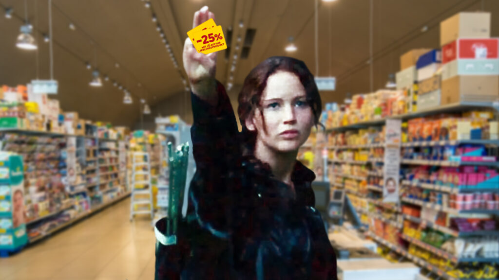 Jennifer Lawrence aus Hunger Games streckt triumphal zwei Rabattpickerl in die Höhe