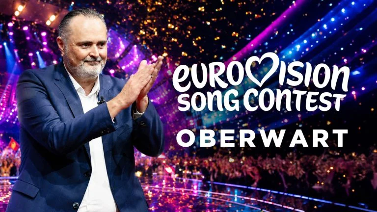 Doskozil applaudiert, daneben Schriftzug "Song Contest Oberwart"
