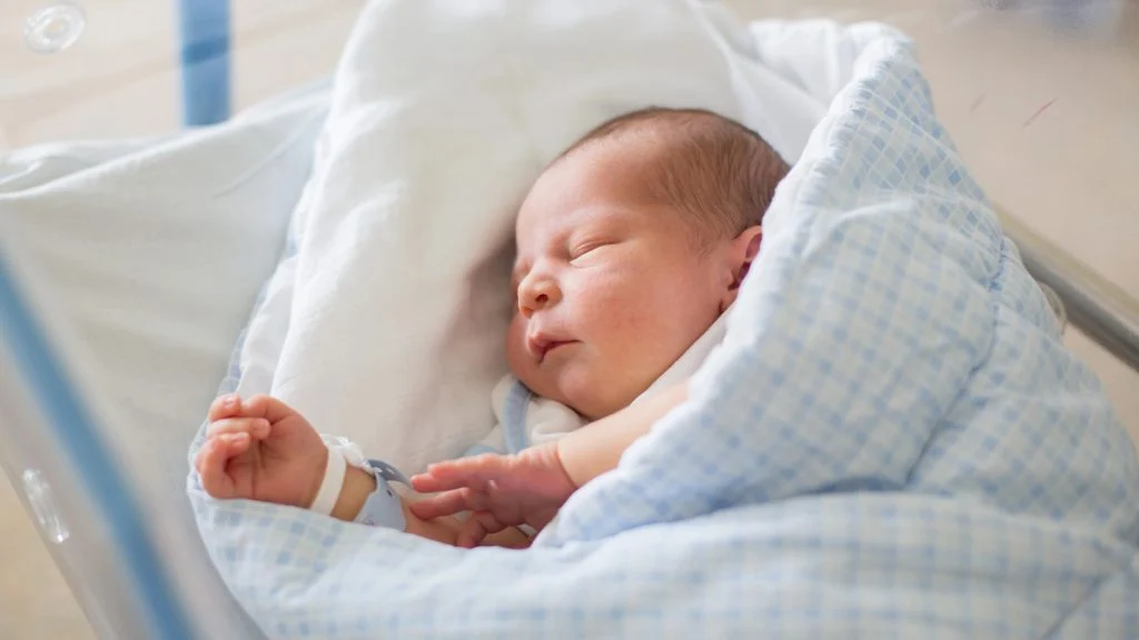 Das Bild zeigt ein schlafendes Baby.